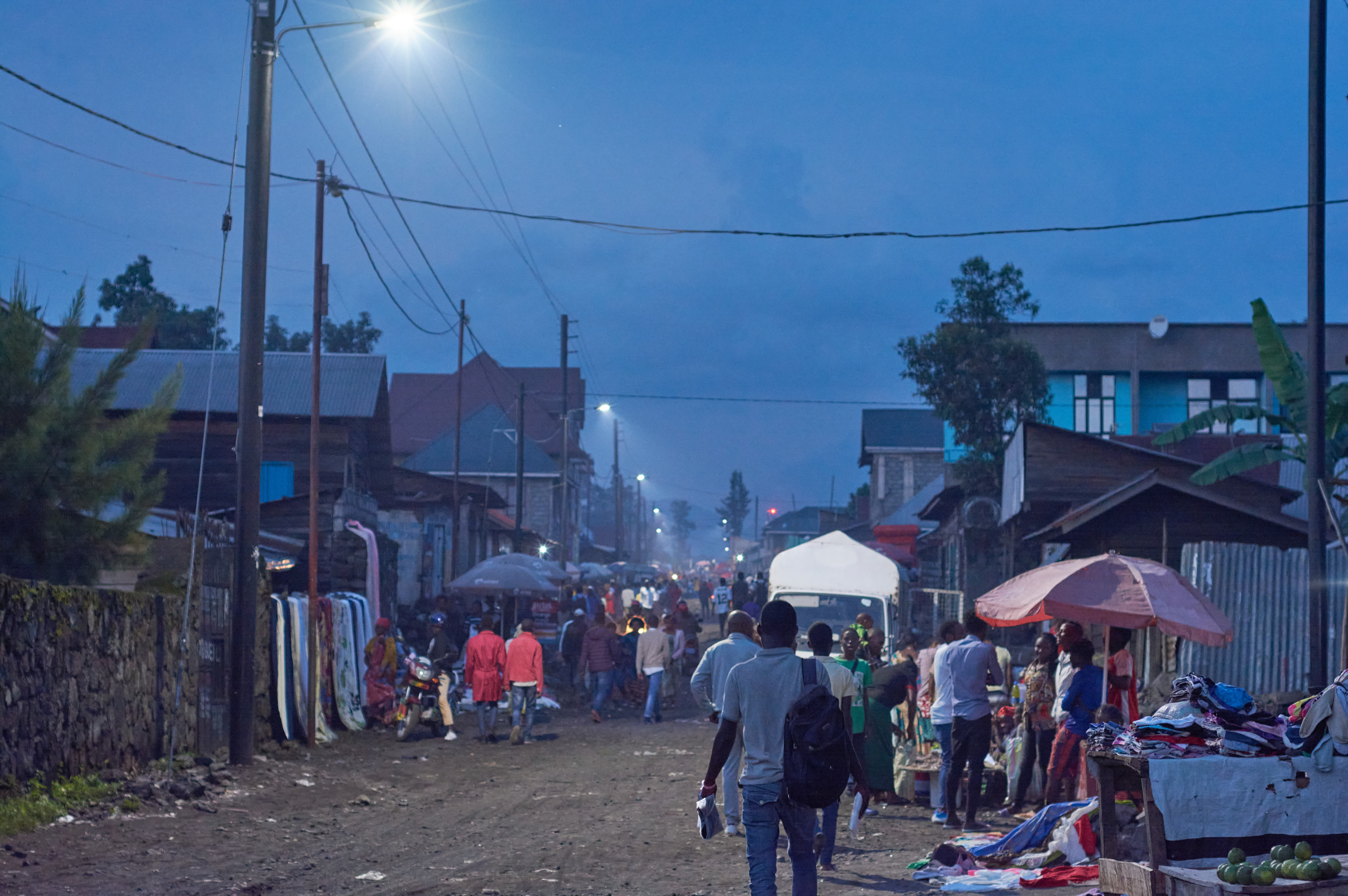 Activities and vendor sales continue into the evening in Goma after streetlights were installed.