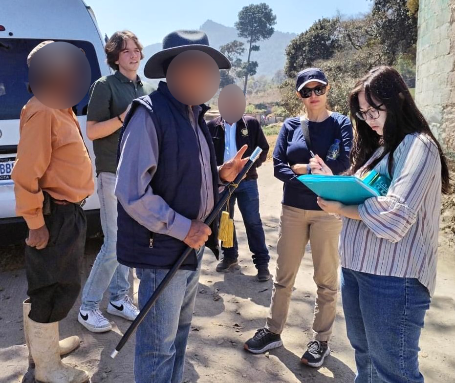 Capstone team interviewing local community members (Identity of individuals blurred for confidentiality)