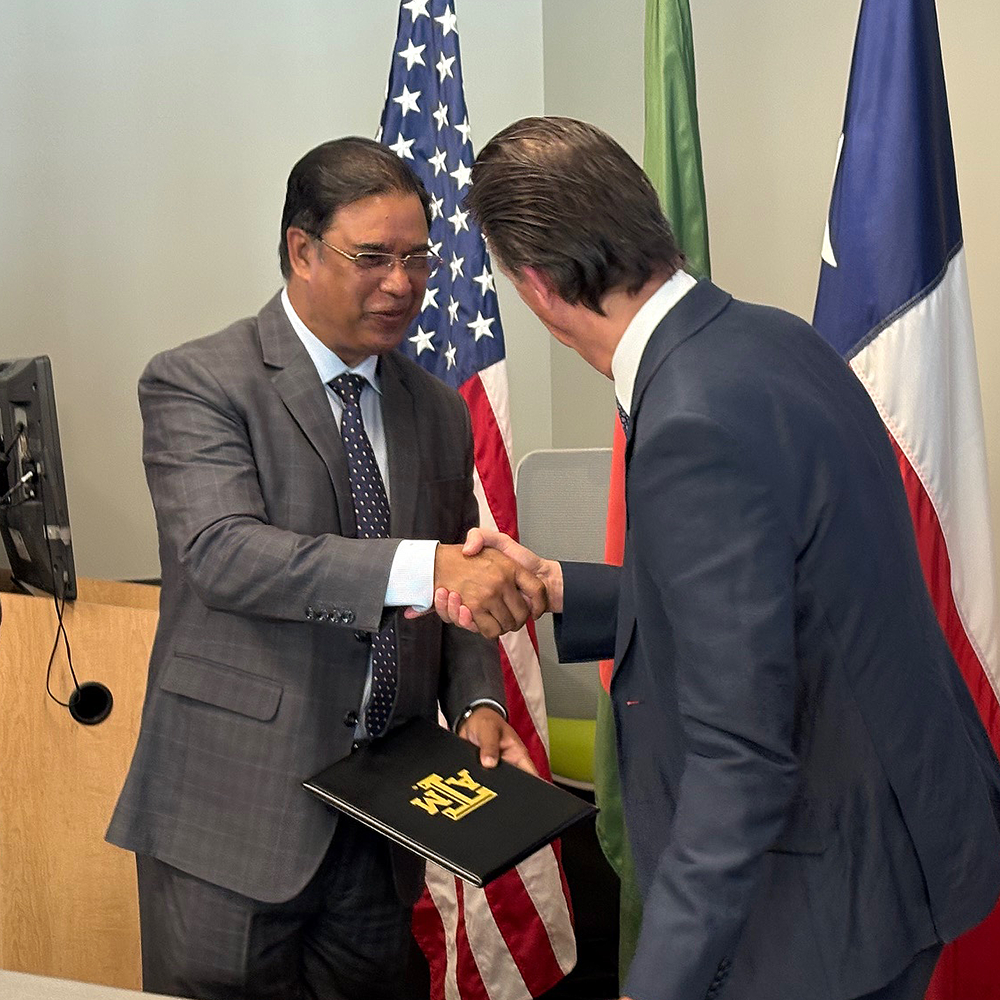 Honorable Chairman of BERC, Jalal Ahmed, and Dr. Stratos Pistikopoulos, the Director of the Texas A&M Energy Institute, shake hands at the Memorandum of Understanding Signing Ceremony between the Texas A&M Energy Institute and the Bangladesh Energy Regulatory Commission.