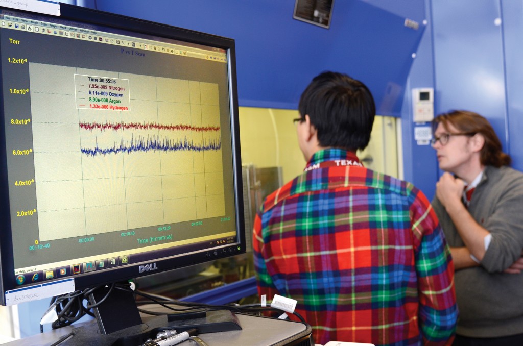 Dr. B.A. Wilhite and doctoral student Haomiao Zhang discuss experimental results